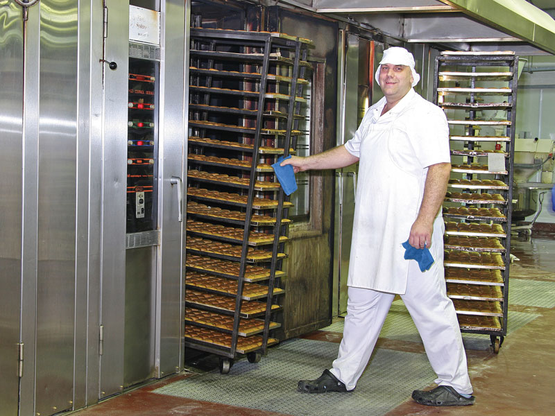 The cakes are baked in large rack ovens until golden brown. The ovens are easy to use. You just push in each rack of cakes, press the timer and wait.